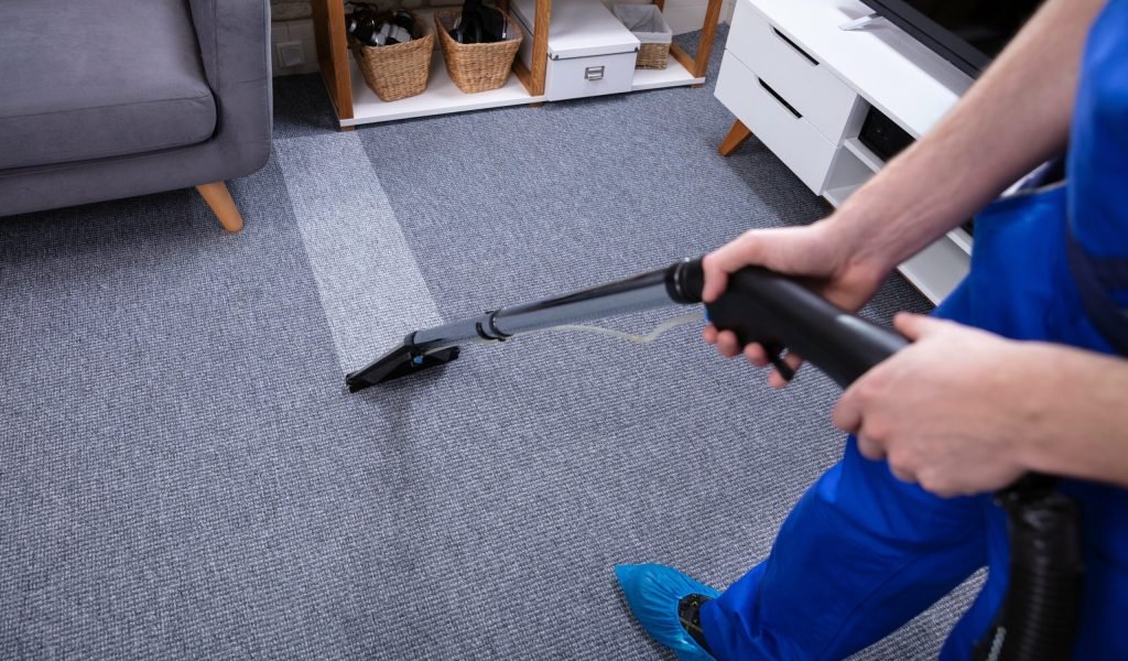 male-janitor-cleaning-carpet